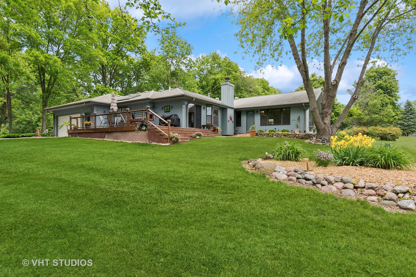 62 Foxhurst Lane Newark, IL 60541 - Photo 31 of 36 a view of a house with a yard deck and a large tree