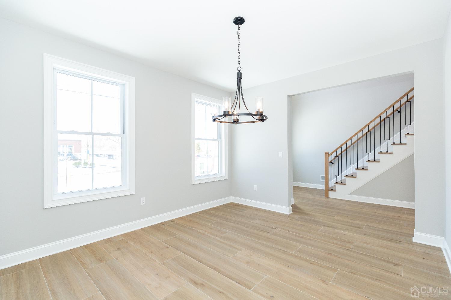60 Brookville Road Edison, NJ 08817 - Photo 11 of 56 a view of an empty room with wooden floor windows