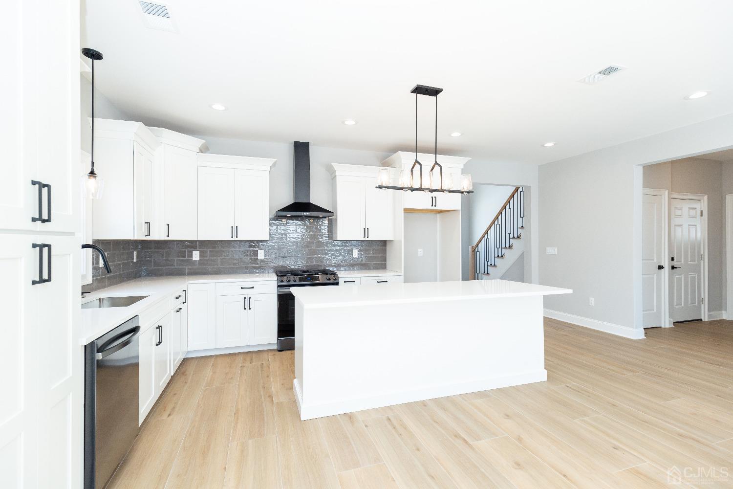 60 Brookville Road Edison, NJ 08817 - Photo 14 of 56 a open kitchen with cabinets a sink and wooden floor
