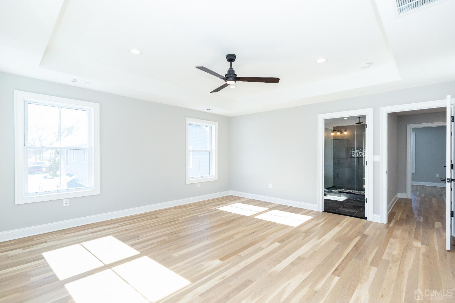 60 Brookville Road Edison, NJ 08817 - Photo 29 of 56 a view of an empty room and window and a chandelier fan