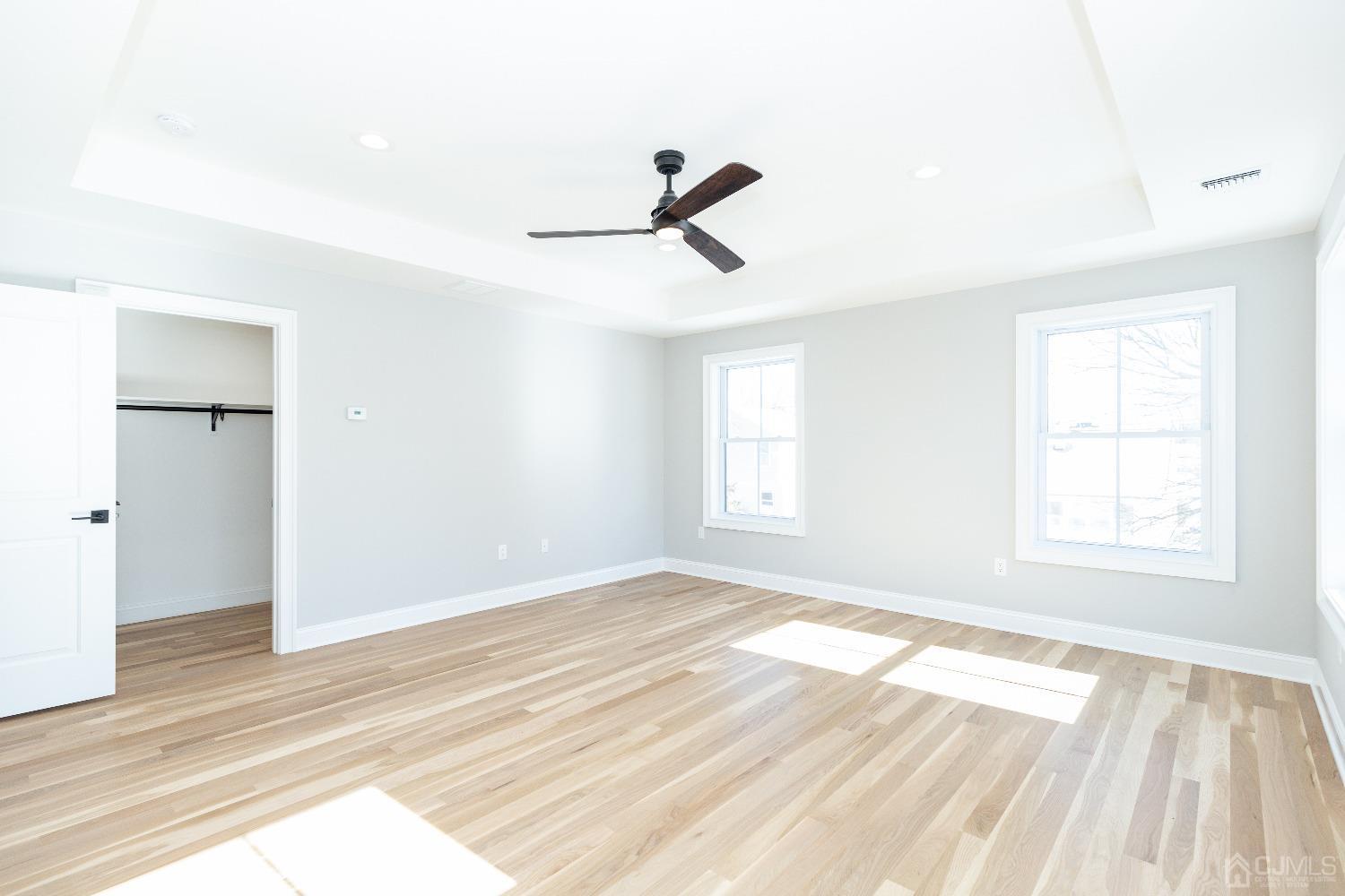 60 Brookville Road Edison, NJ 08817 - Photo 31 of 56 a view of empty room with wooden floor and fan