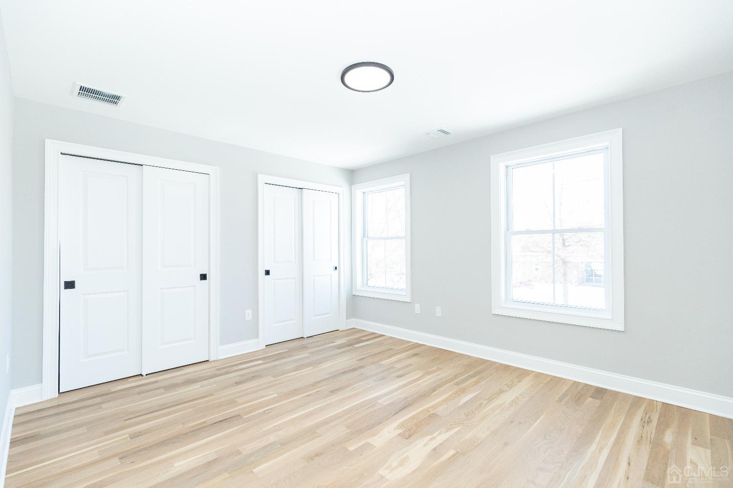 60 Brookville Road Edison, NJ 08817 - Photo 35 of 56 a view of a room with wooden floor and windows
