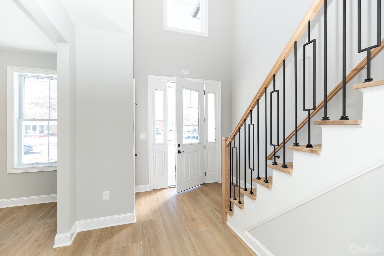 60 Brookville Road Edison, NJ 08817 - Photo 5 of 56 an entryway with wooden floor and stairs