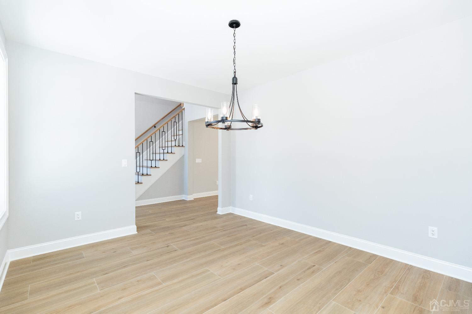 60 Brookville Road Edison, NJ 08817 - Photo 10 of 56 a view of a room with wooden floor and a ceiling fan