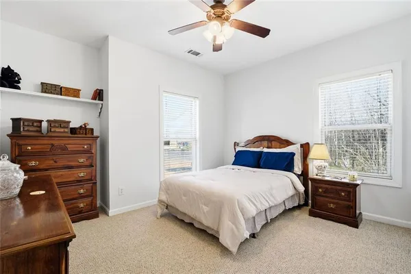 a bedroom with a bed and dresser