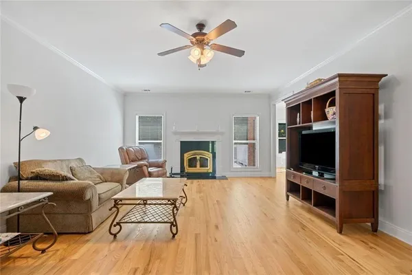 a living room with furniture flat screen tv and a fireplace