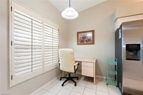 a workspace with furniture and a window