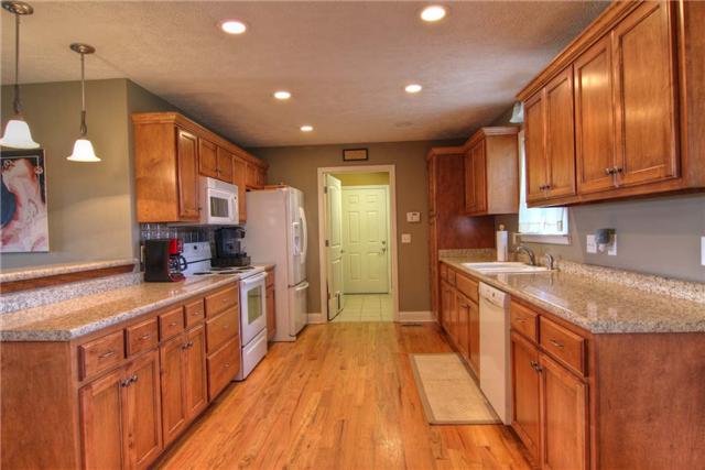 226 Crescent Road Murfreesboro, TN 37128 - Photo 5 of 12 Extra wide galley style kitchen flows into laundry room with tile floors.