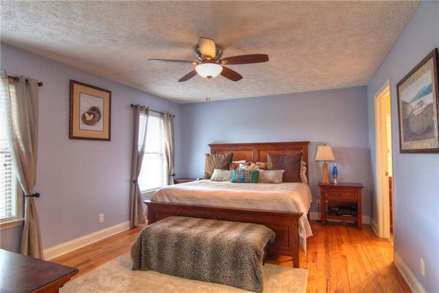 226 Crescent Road Murfreesboro, TN 37128 - Photo 7 of 12 Master bedroom has a large walk-in closet and a sweeping view of the front yard in bloom.