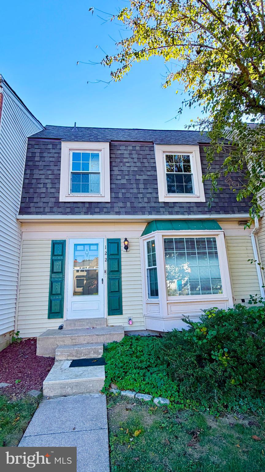 a front view of a house with yard