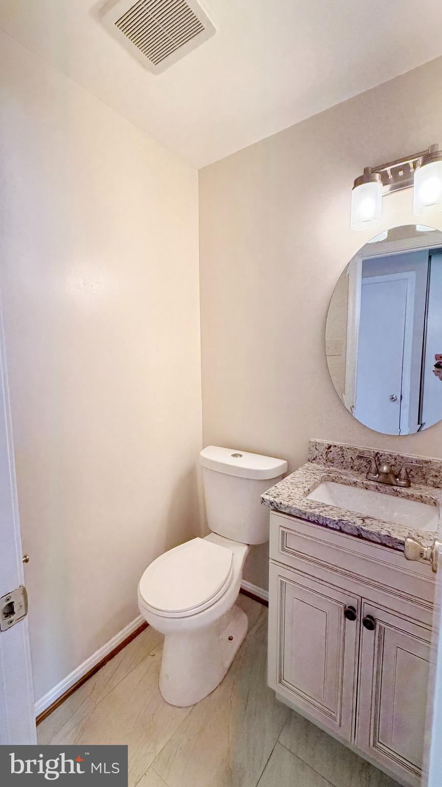 122 Sharpstead Lane Gaithersburg, MD 20878 - Photo 12 of 43 a bathroom with a granite countertop toilet and a sink