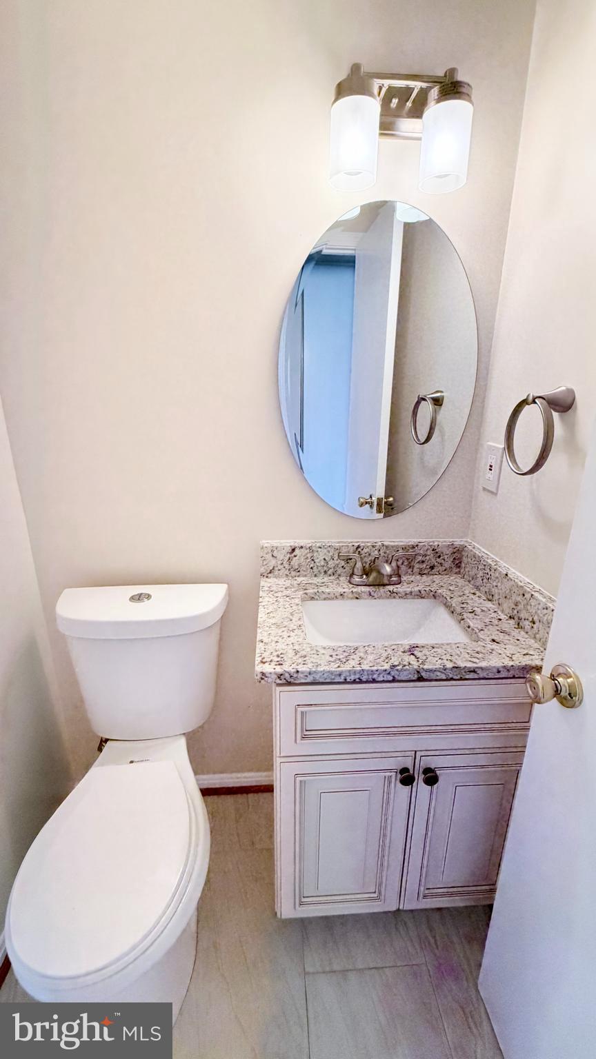 122 Sharpstead Lane Gaithersburg, MD 20878 - Photo 13 of 43 a bathroom with a toilet sink and mirror