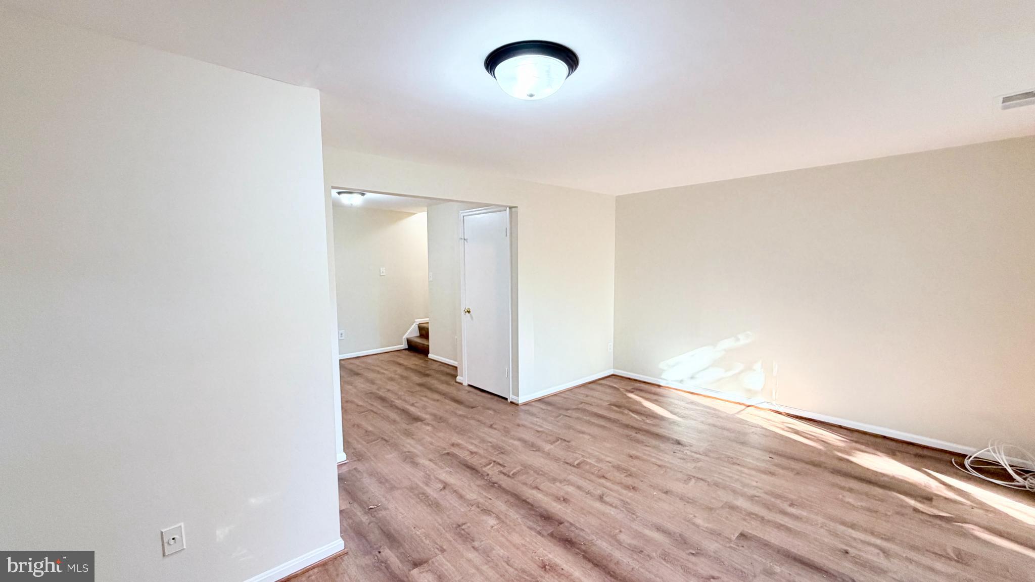 122 Sharpstead Lane Gaithersburg, MD 20878 - Photo 25 of 43 a view of empty room with wooden floor