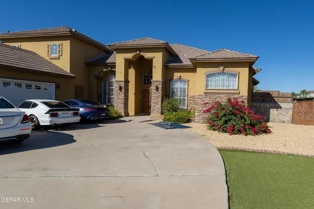 a front view of a house with a small yard