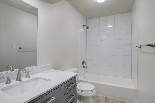 a bathroom with a sink a toilet and a bathtub