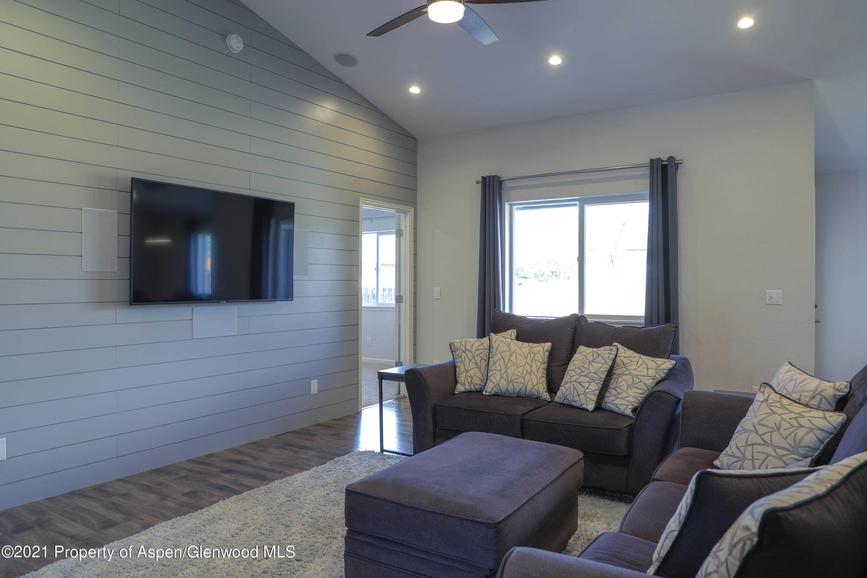 986 East 17th Street Rifle, CO 81650 - Photo 4 of 38 a living room with furniture and a flat screen tv