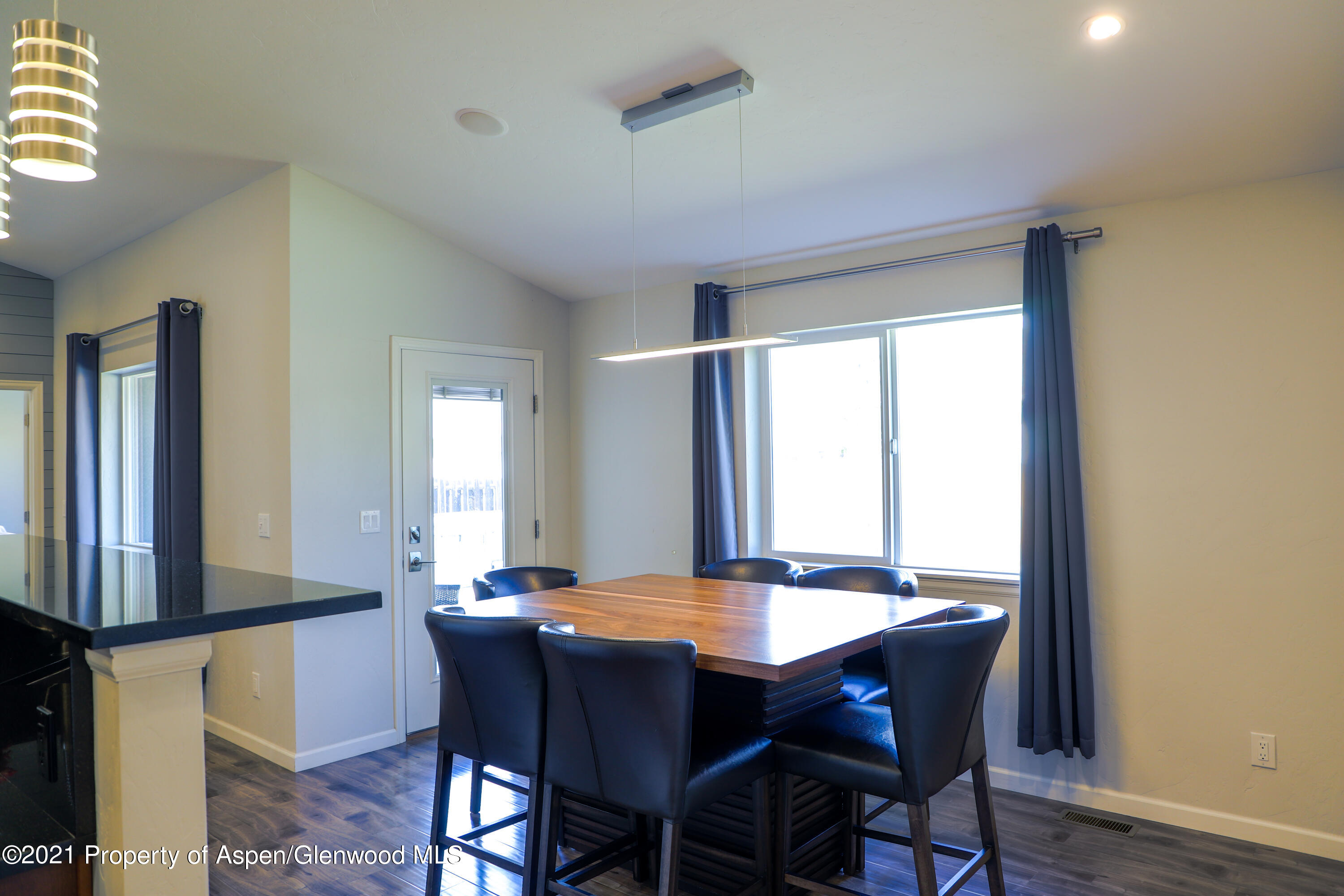 986 East 17th Street Rifle, CO 81650 - Photo 8 of 38 a view of a dining room with furniture and window