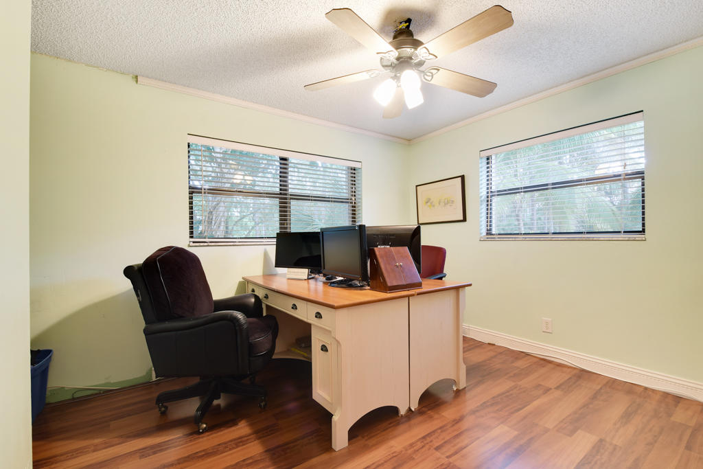 15429 Jupiter Farms Road Jupiter, FL 33478 - Photo 40 of 59 a view of a workspace with furniture and a window