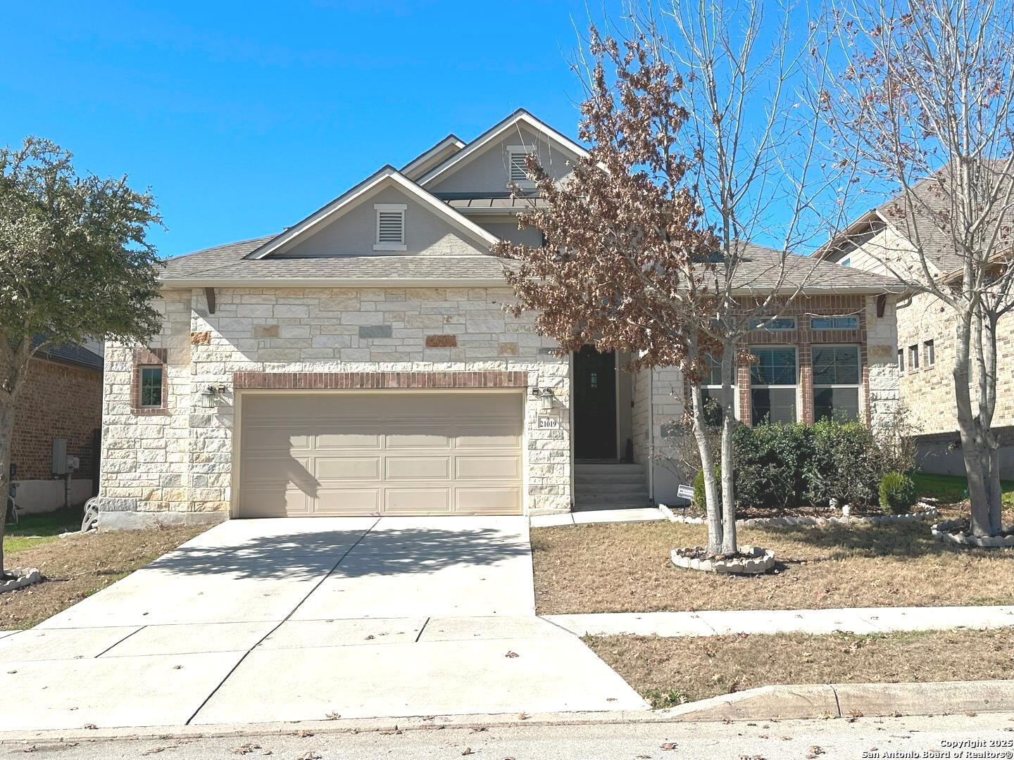 21019 Capri Oaks San Antonio, TX 78259 - Photo 1 of 1 a front view of a house with a yard and garage