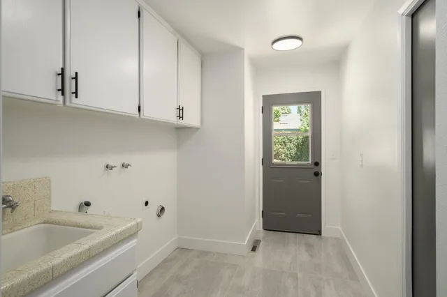 a bathroom with a bathtub and sink