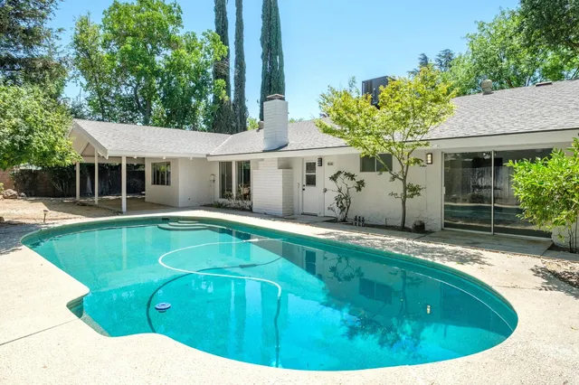 a view of a house with swimming pool