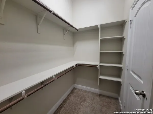 a view of an empty walk in closet