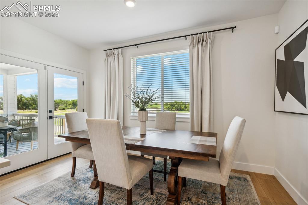 42973 Colonial Trail Elizabeth, CO 80107 - Photo 5 of 10 a view of a dining room with furniture window and wooden floor