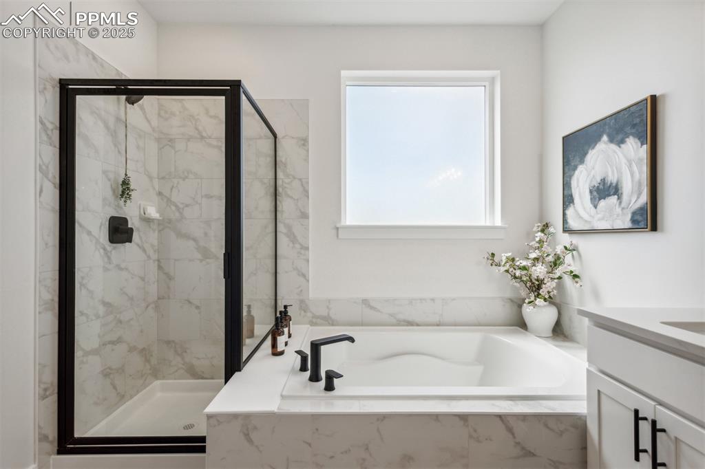 42973 Colonial Trail Elizabeth, CO 80107 - Photo 8 of 10 a white bath tub sitting next to a white sink