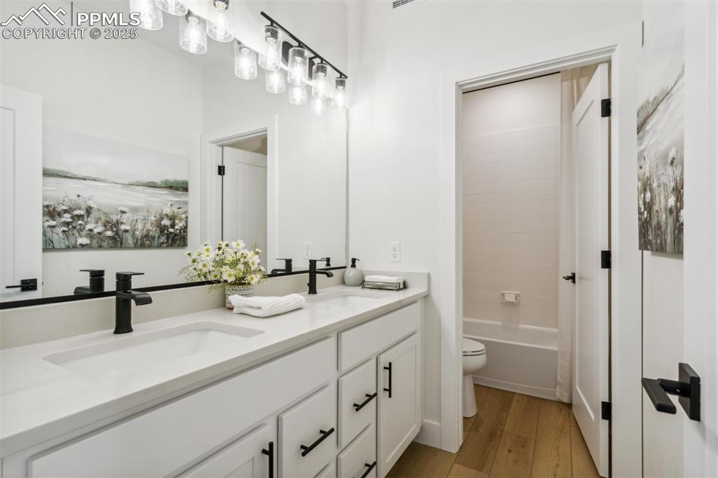 42973 Colonial Trail Elizabeth, CO 80107 - Photo 10 of 10 a bathroom with a double vanity sink mirror and shower