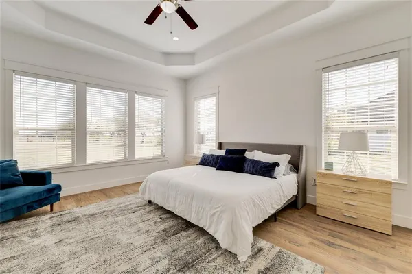 a bedroom with a large bed and a couch