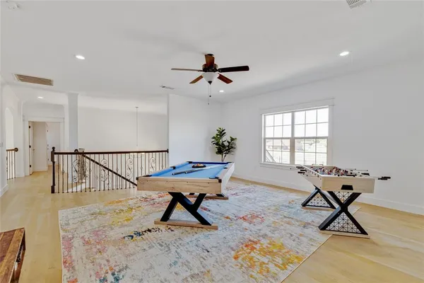 a work room with furniture and wooden floor