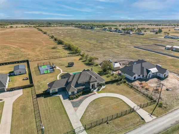 an aerial view of residential houses with outdoor space