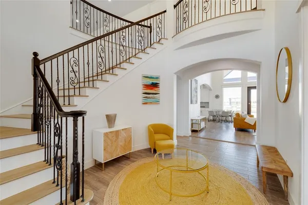 a view of entryway and hall with wooden floor