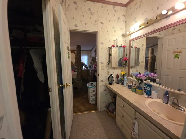 a bathroom with a double vanity sink and a mirror