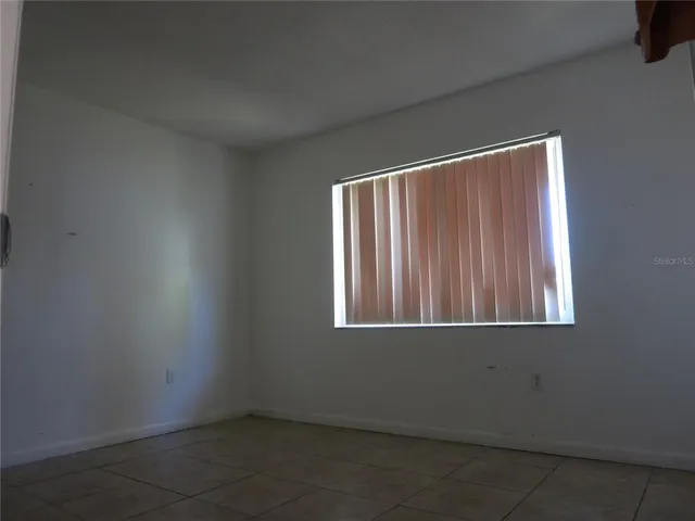 an empty room with window