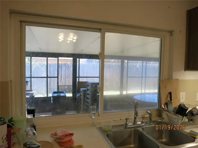 a kitchen with granite countertop a sink and a counter top space