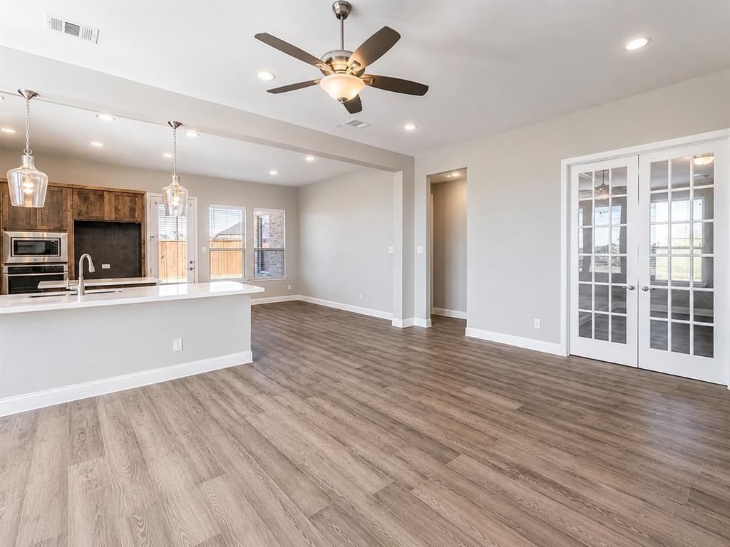 6209 Cupleaf Road Flower Mound, TX 76226 - Photo 5 of 29 Spacious open-concept living area featuring wood-finish flooring, recessed lighting, and a ceiling fan