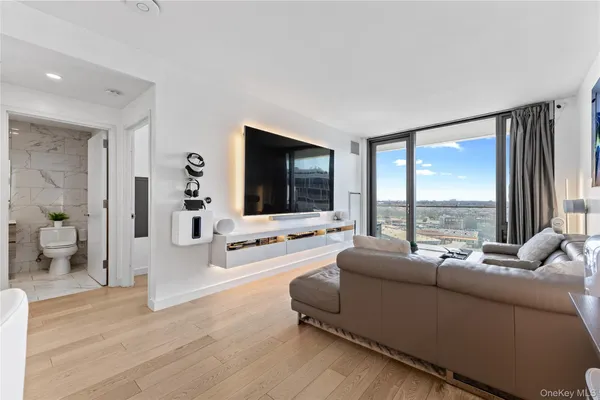 a living room with furniture and a large window