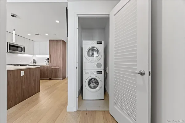 a view of a kitchen cabinets a sink and wooden floor