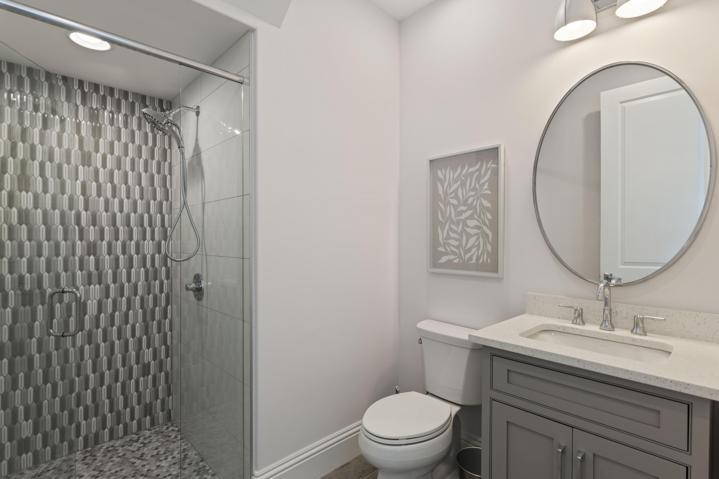 26 Azzurro Way Santa Rosa Beach, FL 32459 - Photo 47 of 78 a bathroom with a sink a mirror a toilet and shower