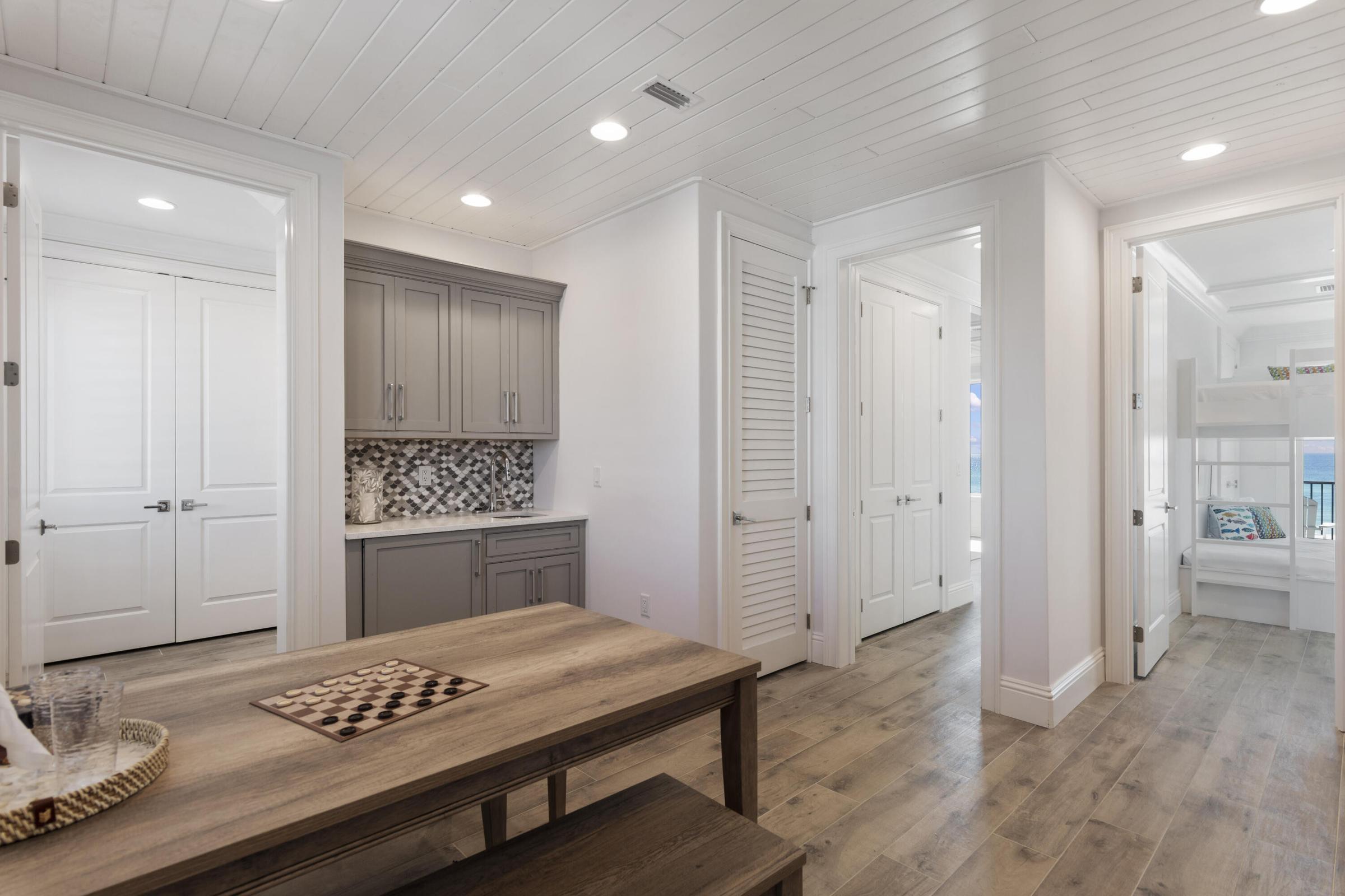 26 Azzurro Way Santa Rosa Beach, FL 32459 - Photo 56 of 78 a spacious bathroom with a sink a toilet a shower and a large mirror