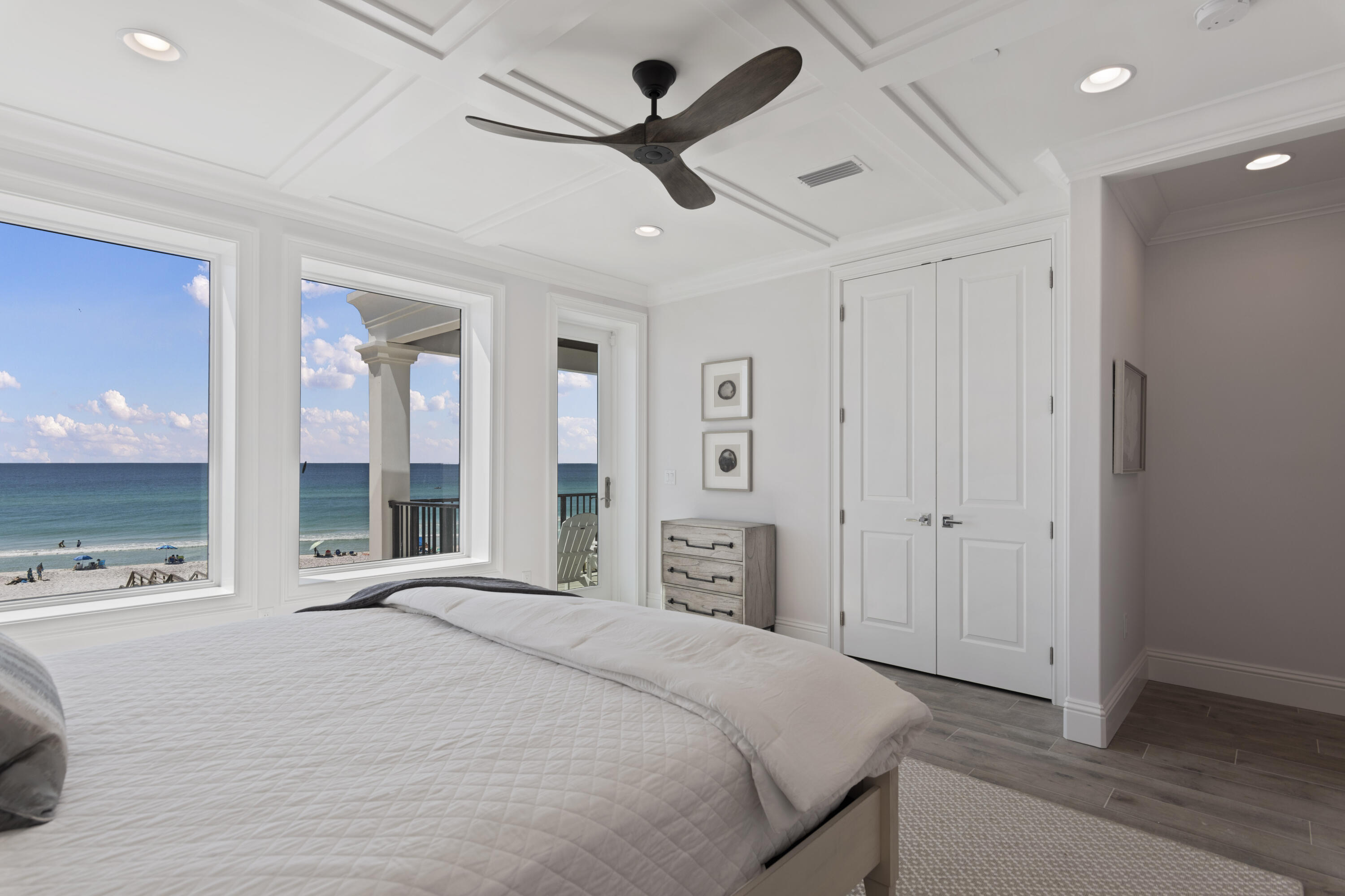 26 Azzurro Way Santa Rosa Beach, FL 32459 - Photo 60 of 78 a spacious bedroom with a bed and a large mirror