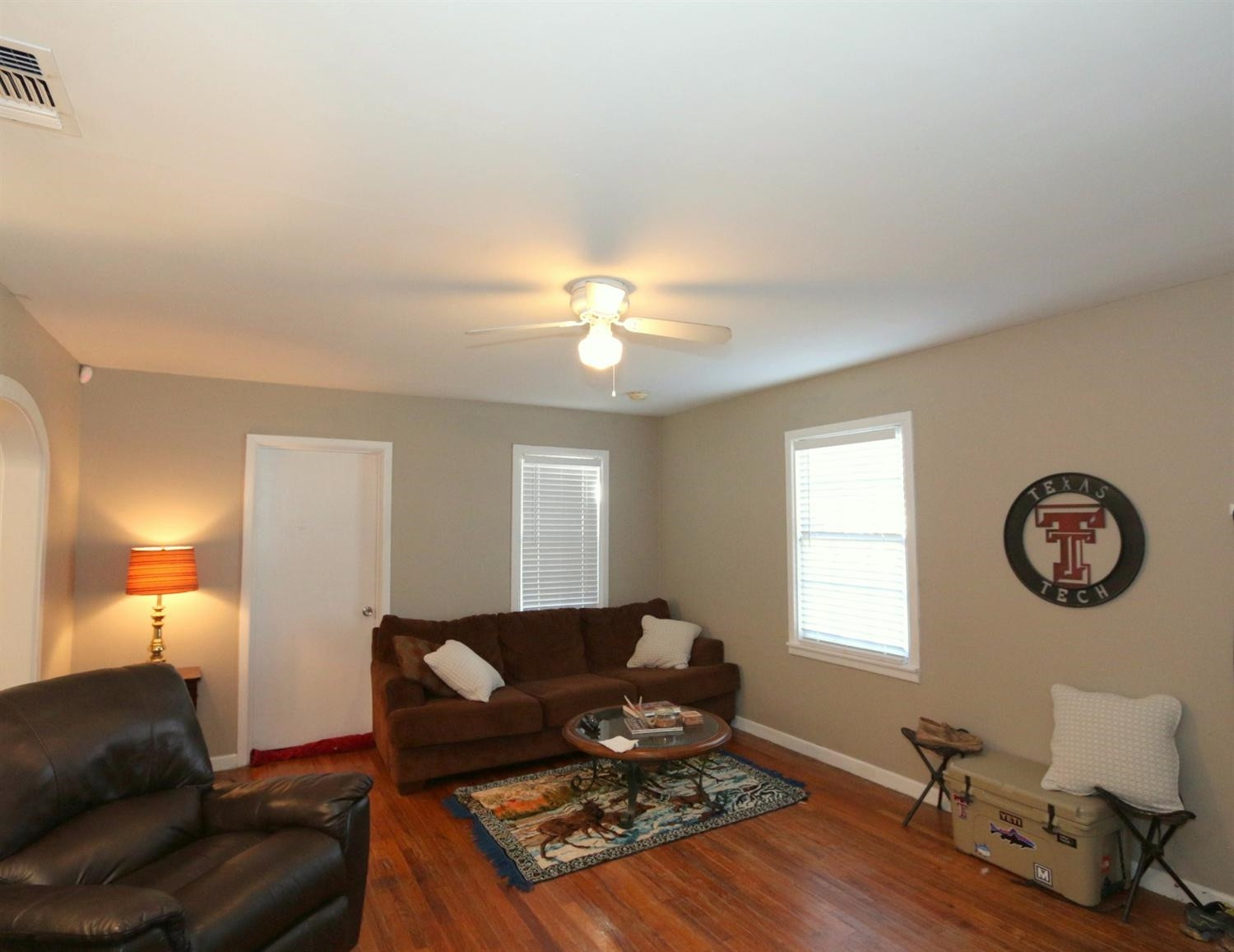 2405 22nd Street Lubbock, TX 79411 - Photo 4 of 10 a living room with furniture a window and a lamp