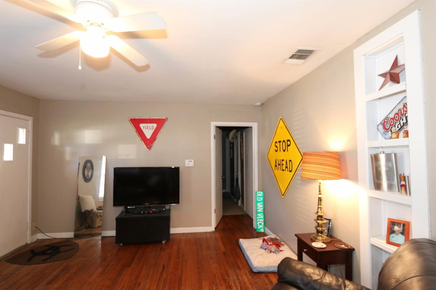 2405 22nd Street Lubbock, TX 79411 - Photo 5 of 10 a living room with furniture and a flat screen tv