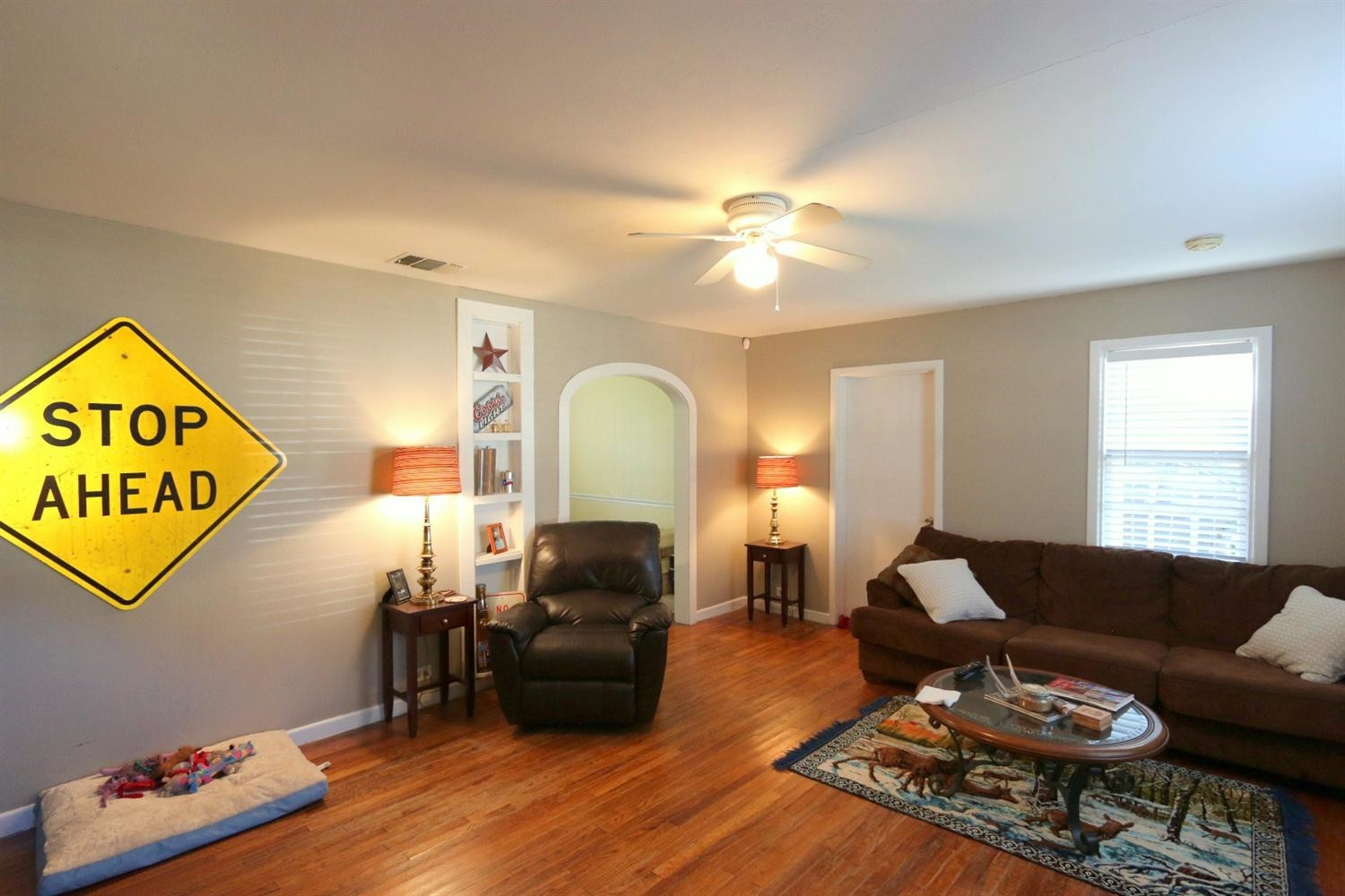 2405 22nd Street Lubbock, TX 79411 - Photo 7 of 10 a living room with furniture and wooden floor