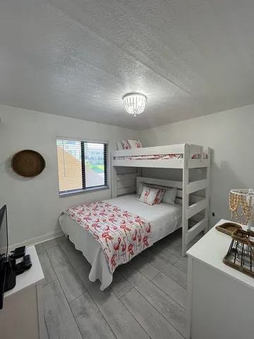 a bathroom with a sink a toilet a mirror and vanity