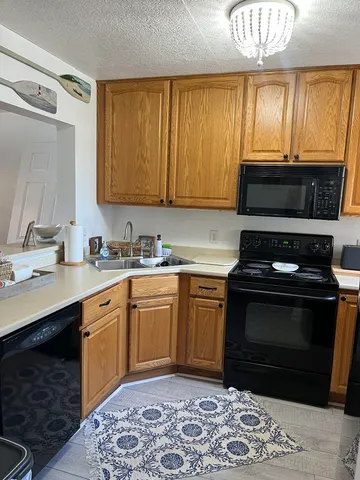 a kitchen with a stove and a sink