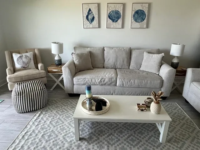 a living room with a couch and cabinets