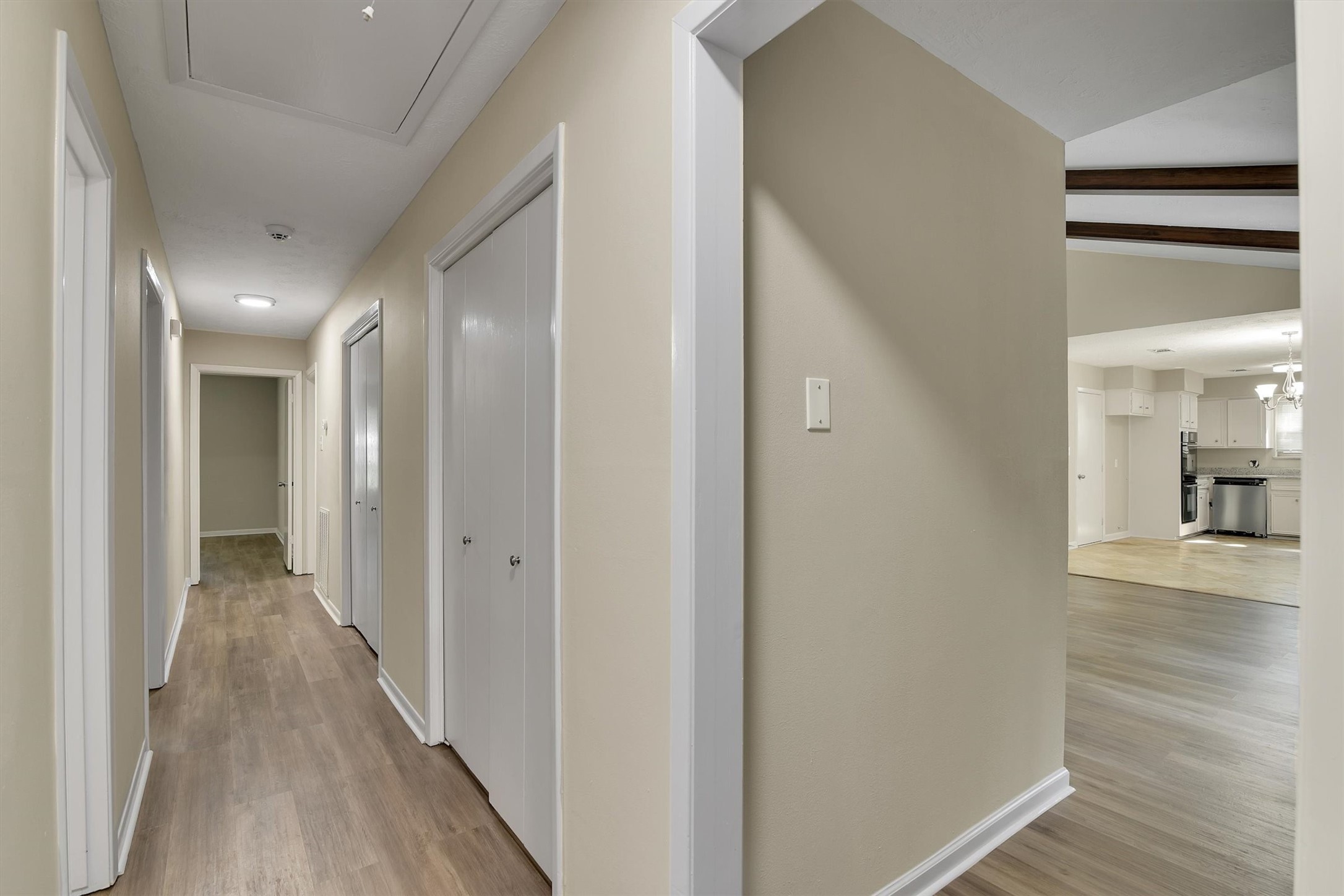 345 Maple Lane Conroe, TX 77304 - Photo 13 of 35 a view of a hallway with wooden floor