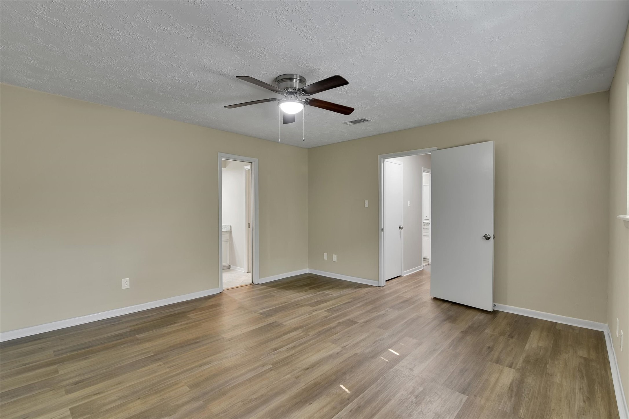 345 Maple Lane Conroe, TX 77304 - Photo 15 of 35 a view of an empty room and wooden floor